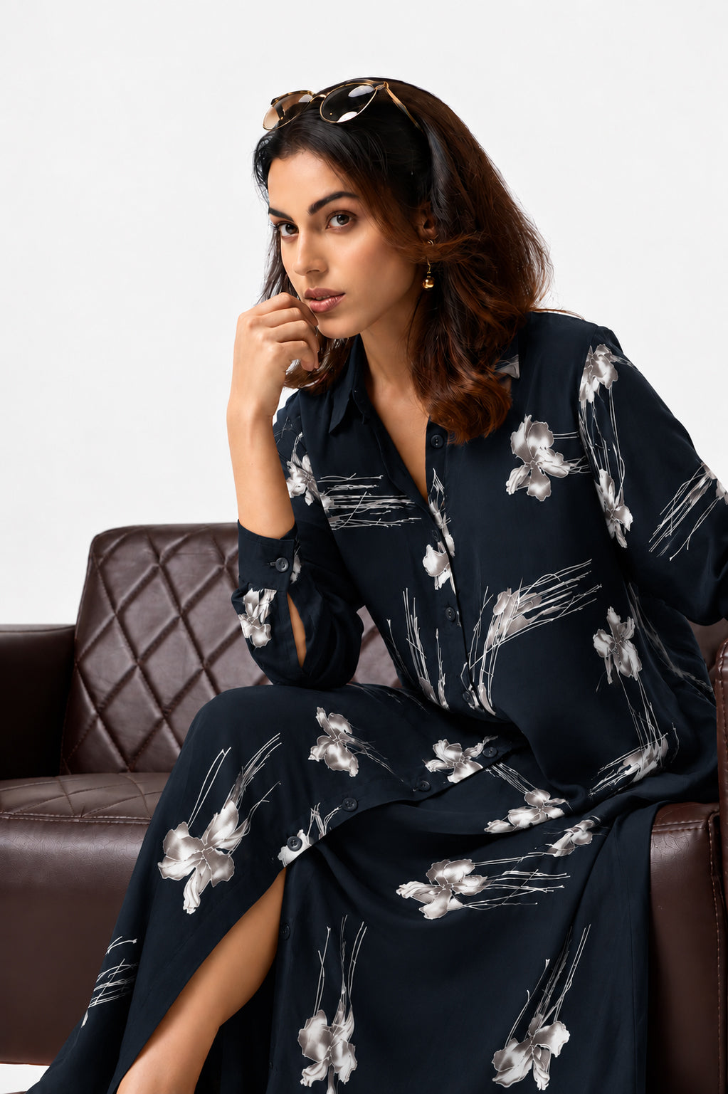 Serenaire Veloria Blossom Sketch Workwear Dress in Navy Blue — seated on a sofa