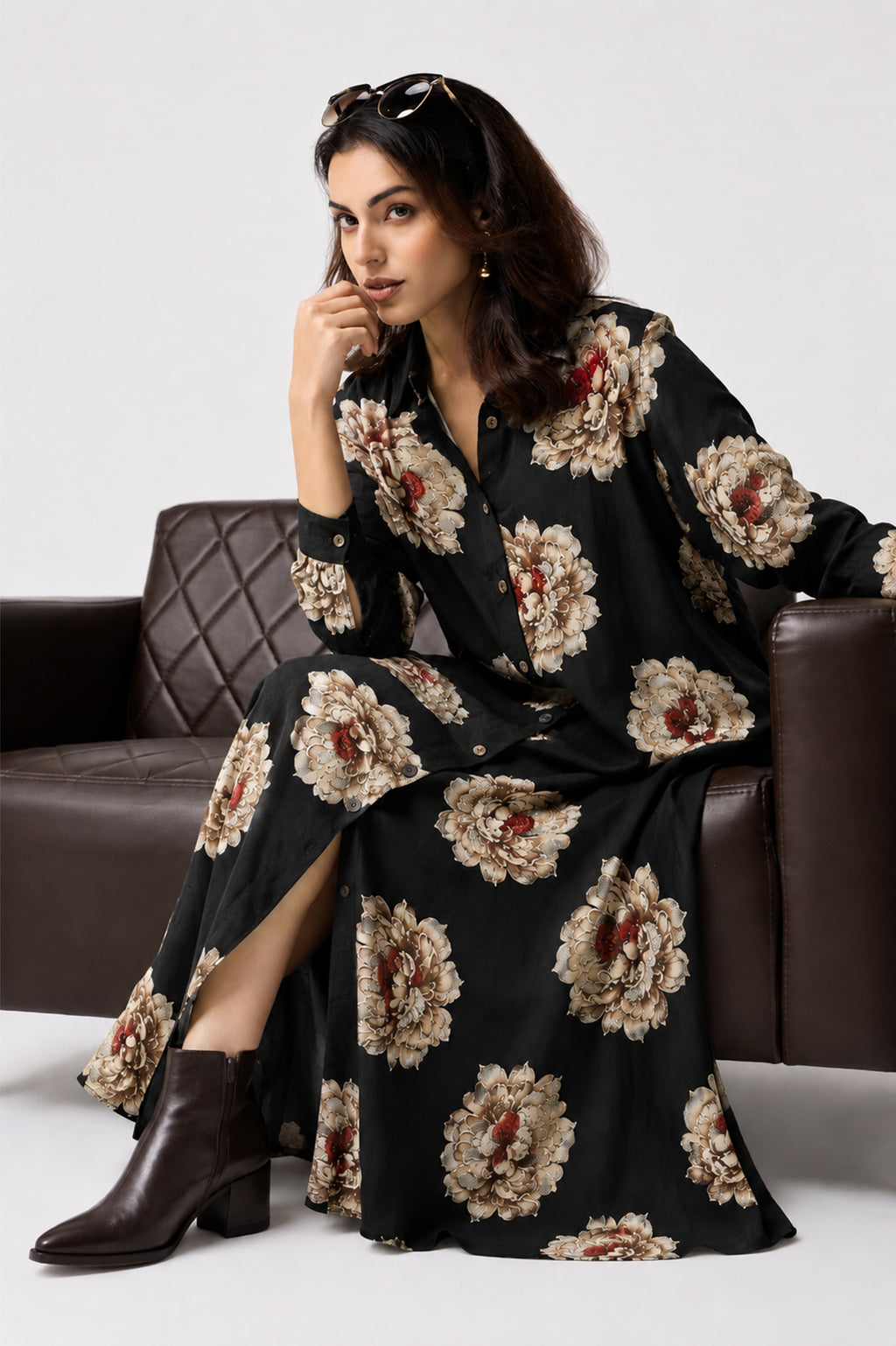 Serenaire Veloria Chrysanthemum Workwear Dress in Black — seated on a sofa