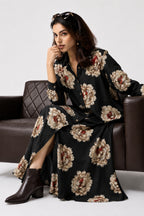 Serenaire Veloria Chrysanthemum Workwear Dress in Black — seated on a sofa