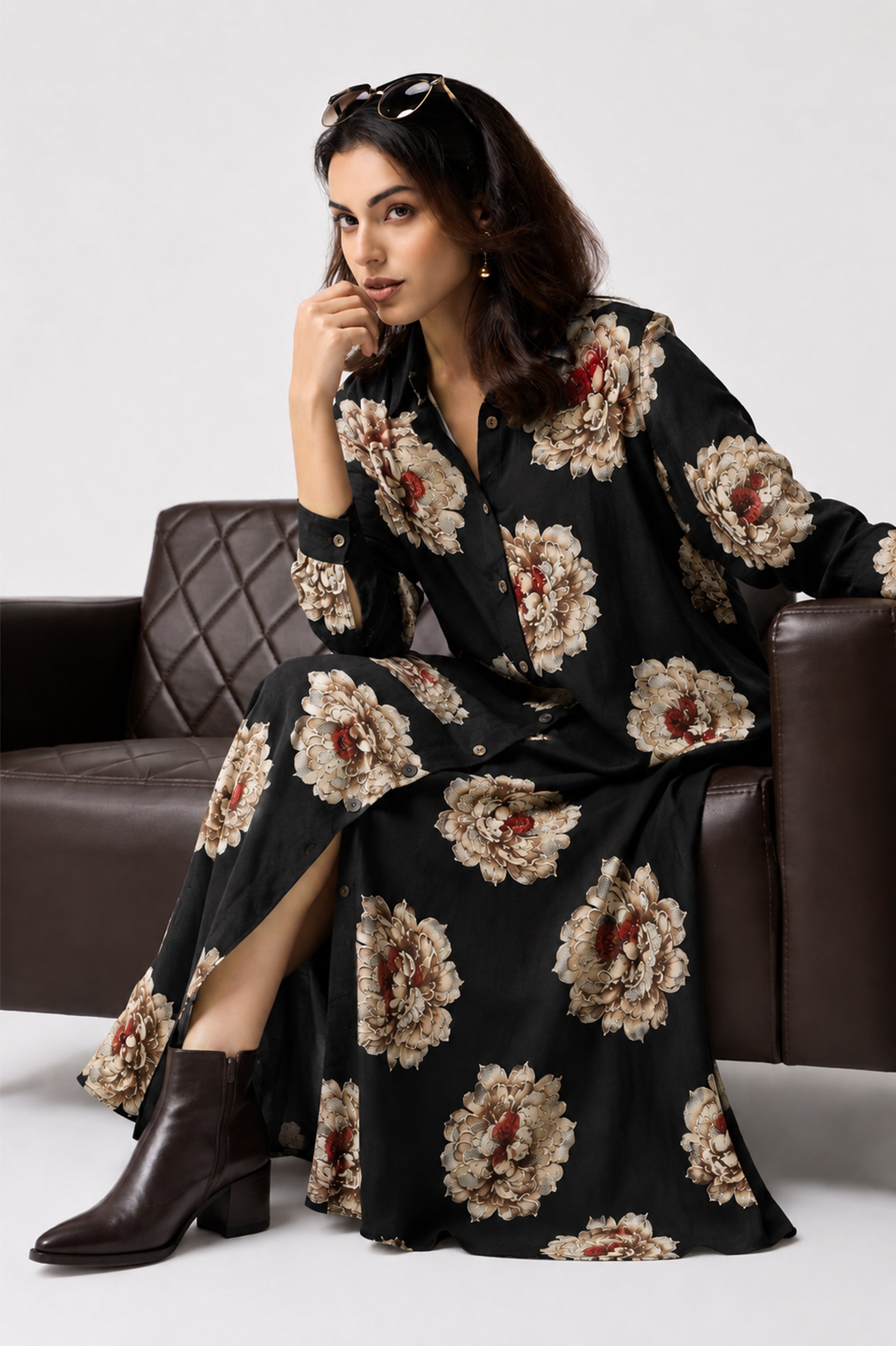 Serenaire Veloria Chrysanthemum Workwear Dress in Black — seated on a sofa