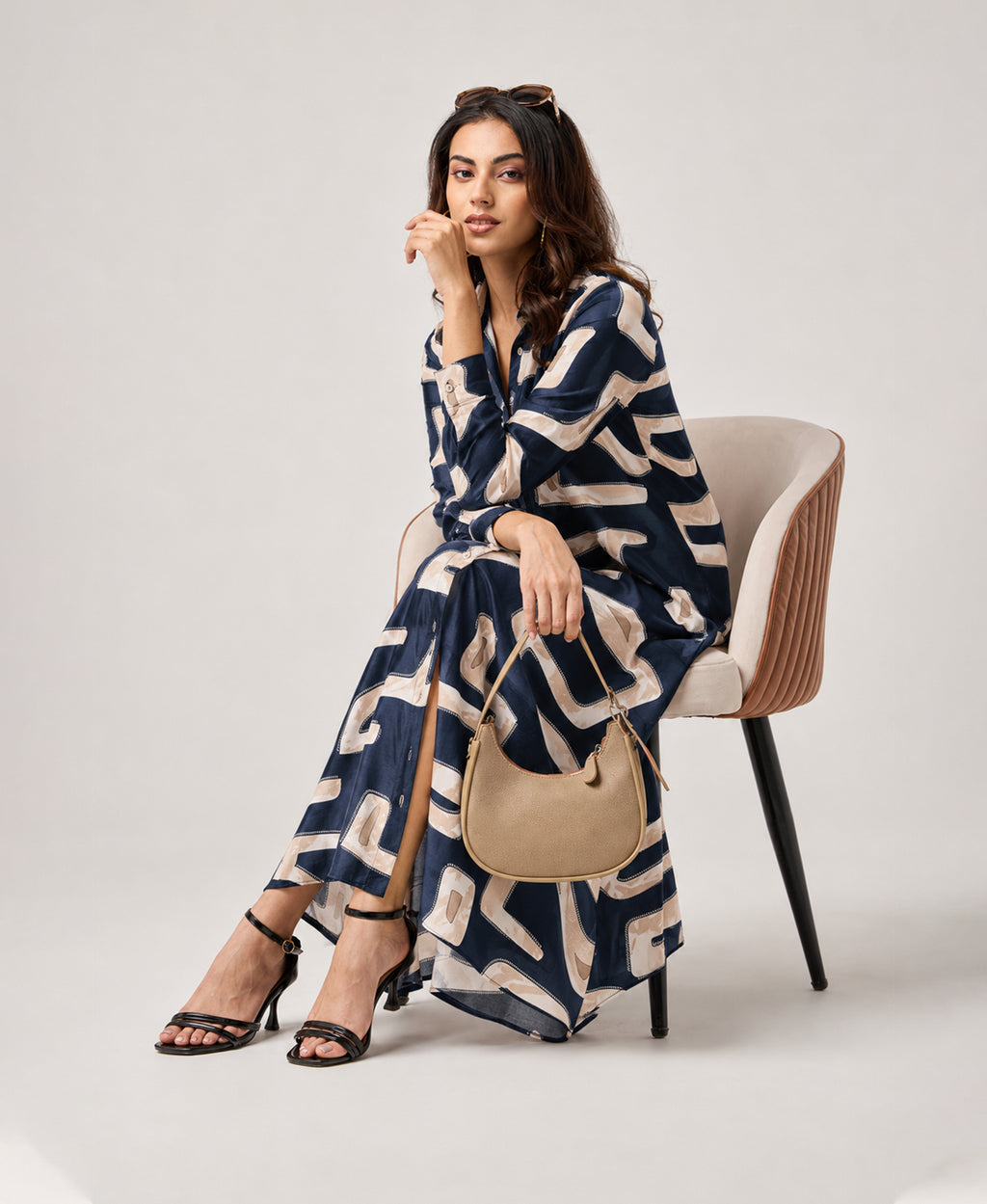Serenaire Veloria Cutout Workwear Dress in Navy Blue — seated with bag
