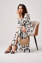 Serenaire Veloria Pebble Workwear Dress in White — seated with bag