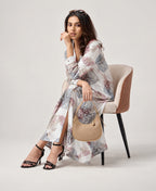 Serenaire Veloria Skeleton Leaf Workwear Dress in Ivory — seated with bag