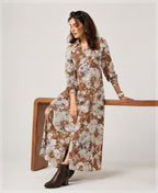Serenaire Veloria Watercolour Bloom Workwear Dress in Mud — leaning against a table